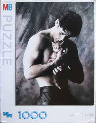 Man Cuddling Kitten