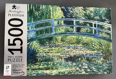 Bridge over a pond of water lilies by Claude Monet