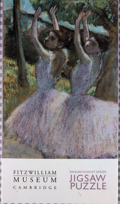 Dancers in violet dresses, arms raised